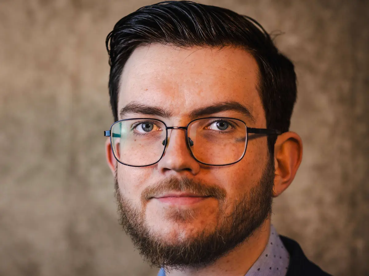 Johnny Robinson working through mathematical problems with students